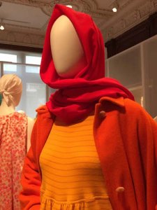 An early 1988 look in orange-orange wool – scarf, coat, and jumpsuit