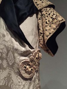 Poiret’s 1911 kimono-inspired draped silk damask opera coat embellished with silk cord